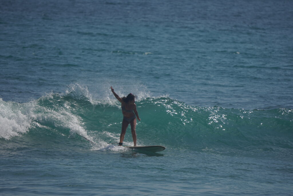 intermediate surfer surfs at Thomas Beach